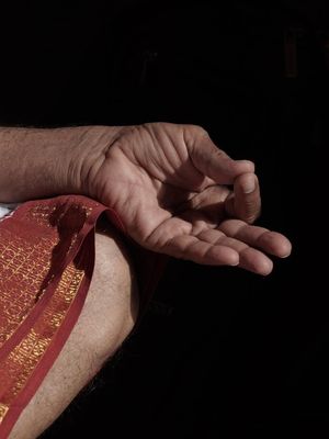 Close up of hands in a meditative pose during practice